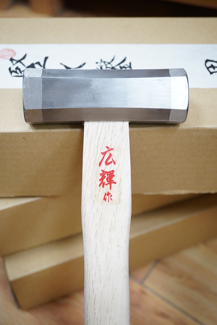 A collection of Japanese woodworking chisels and hammers, including; three boxed large mortise chisels, three boxed timber framing chisels (largest 90mm), and five heavy duty hammers/mallets (11)